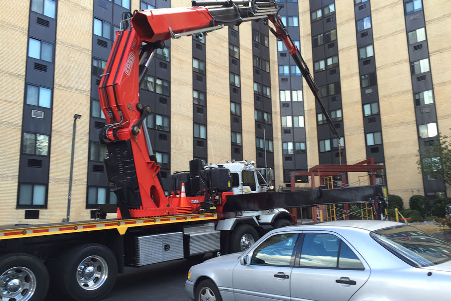 Boom crane lifting materials